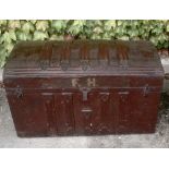 Antique Saratoga travelling trunk with original printed paper linings