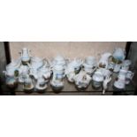 Quantity of crested china wiht vignettes of West Country towns (landmarks etc) approx 25 pieces on
