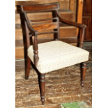 Early 19th C library arm chair in mahogany with upholstered seat and turned front legs