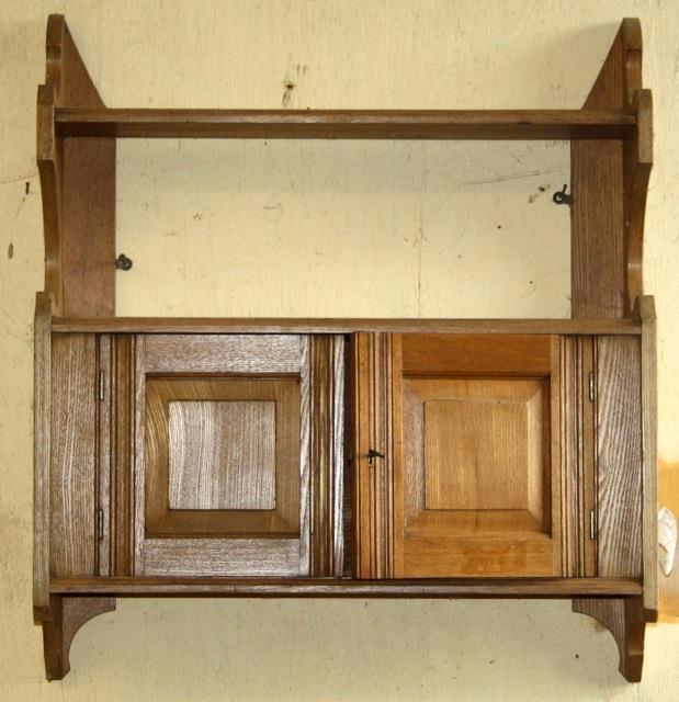 Edwardian oak wall hanging shelf unit with cupboard to lower half