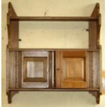 Edwardian oak wall hanging shelf unit with cupboard to lower half