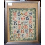 Alphabet sampler dated 1915, framed and glazed