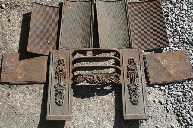 Early 19th C cast iron fire inserts with Rococo releif design