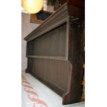 Dark varnished old dresser rack (difficult to view as it is on top of the door rack!)