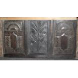 Ancient carved oak panel, arched motifs flanking floral centre