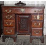 18th C kneehole mahogany desk, 7 drawers and cupboard under