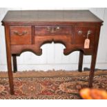 18th C oak lowboy with 3 drawers, decorative frieze and straight legs with inside chamfer