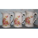 Graduated set of three antique floral transfer printed jugs