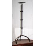 Old iron pricket stand on tripod base