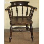 Antique smoker's bow or captain's chair in elm and beech