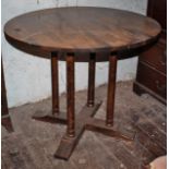 Vintage circular table with 4 turned legs on cruciform base