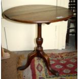 Georgian oak circular occasional table on trefoil base.