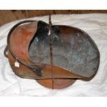 Victoria copper coal-scuttle with wrought iron handle and a wrought iron toasting fork