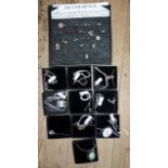 Board and boxes containing silver and semi precious stone jewellery - a lot
