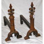 Pair of antique Fleur de Lis crested fire dogs