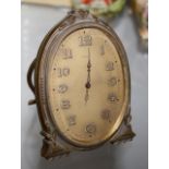 Antique desk clock with oval face in Gilt case (In Lot 295)