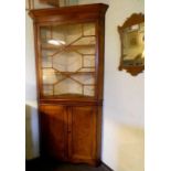 Georgian full-length corner cupboard in fruitwood and oak with pine back boards. Shelved cupboard to