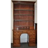 Late Victorian mahogany kneehole desk with bookcase over. The latter having adjustable shelves and
