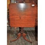 Victorian square tilt top table raided on turned pedestal with sabre legged tripod base