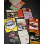 Books on cars, racing and Range Rover Manuals on bottom shelf of lot 598