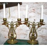 A pair of brass art nouveau candelabra