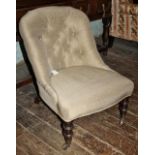 Victorian buttoned nursing chair on turned legs, original brass castors