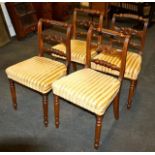 Set of four ornate dining chairs in mahogany, Regency stripe seats, circa 1825