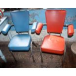 Pair of tubular framed vintage elbow chairs with red and blue vinyl upholstery