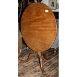 Georgian tilt top circular table (35 inch diameter) raised on pedestal with cabriole legs with pad