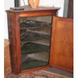 Georgian oak corner cupboard with panelled door. The interior having 3 shelves and the original dark