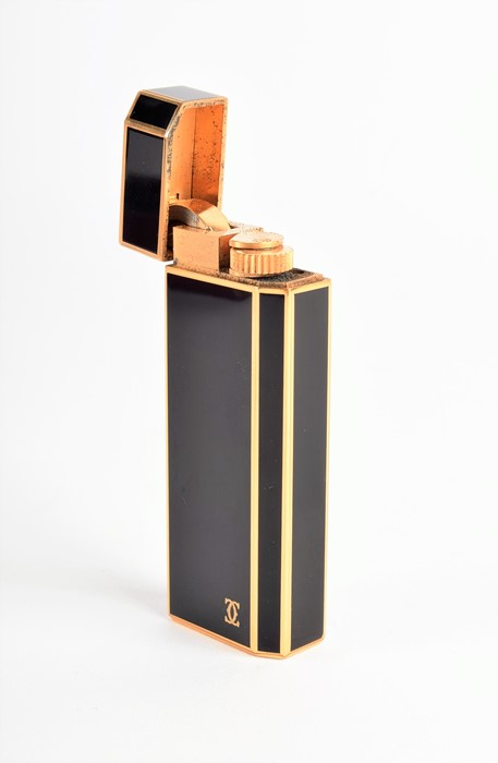 A Cartier lighter with its original box of pentagon form, 18k gold plate and black enamel - Image 4 of 5