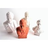 A collection of four ceramic Russian busts to include Vladimir Lenin, Nikolai Ostrovsky and Joseph