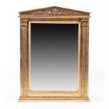 A Regency style architectural giltwood pier mirror in the Classical taste, the frame with reeded