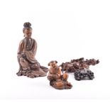 A group of three Japanese Meiji period carved hardwood figures to include a large figure of a seated