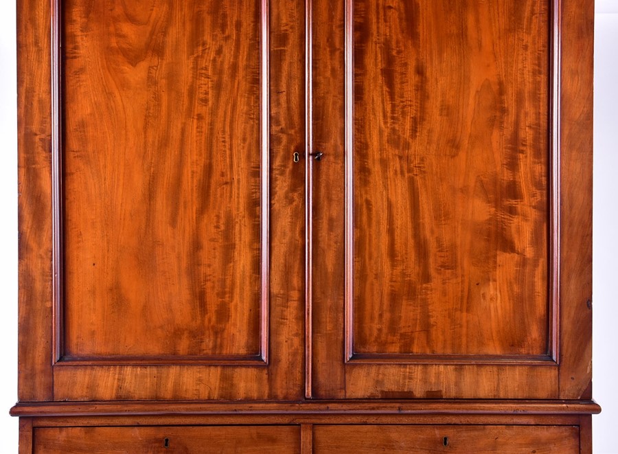 A 19th century mahogany linen press with two cupboard doors over two short and three graduated - Image 7 of 7