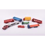 A collection of eight loose vintage playworn Dinky Toys vehicles comprising two Mobilgas Tankers,