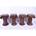 A set of four small oak plinths / plant stands modelled as Corinthian columns on stepped circular
