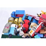 A quantity of loose and playworn Corgi Toys diecast vehicles to include racing cars, TV novelty