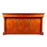 A modern Italian Empire style walnut sideboard the top with bevelled glass protector, above two