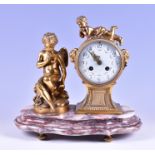 A 19th century French ormolu drum shaped mantel clock the white enamel dial with painted flowers,
