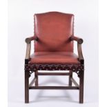 An oak and red leather studded armchair  on straight legs, 64 cm wide.