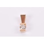 A 14ct yellow gold and solitaire diamond pendant the round brilliant-cut diamond approximately 0.