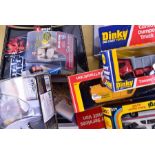 A large quantity of boxed diecast model vehicles and other toys to include Corgi, Dinky and Burago