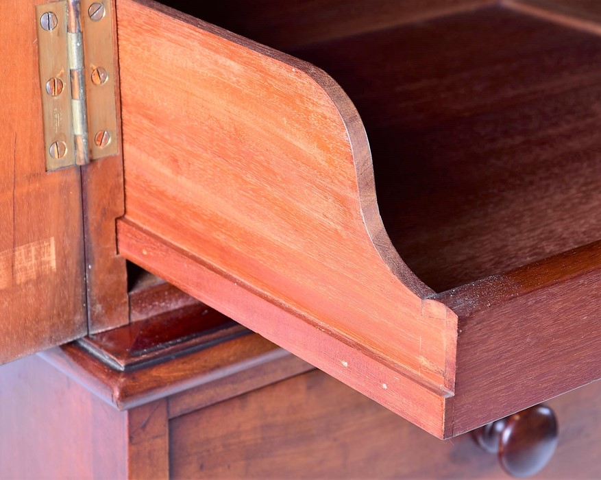 A 19th century mahogany linen press with two cupboard doors over two short and three graduated - Image 5 of 7