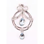 A 9ct white gold, diamond, and blue topaz drop pendant in the Edwardian style, the round openwork