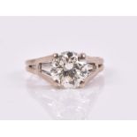 An 18ct white gold and solitaire diamond ring set with a round brilliant-cut diamond of
