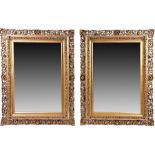 A pair of French 19th century gilt framed mirrors in the Rococo taste with gilt pierce scrolled