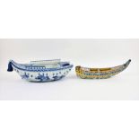 A 20th century Chinese ceramic planter modelled as boat with blue and white underglaze decoration,