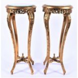 A pair of 20th century gilt etagerés with glass tops  and pierced frieze decoration, on four swept
