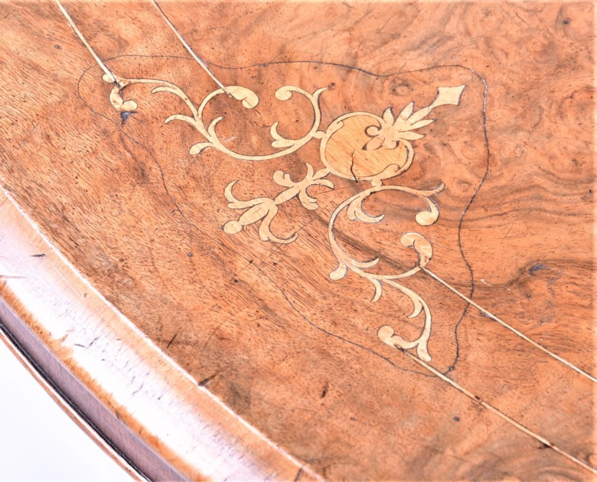 A late Victorian walnut and inlaid oval loo table  with quarter-veneered top, the matched base on - Image 4 of 5